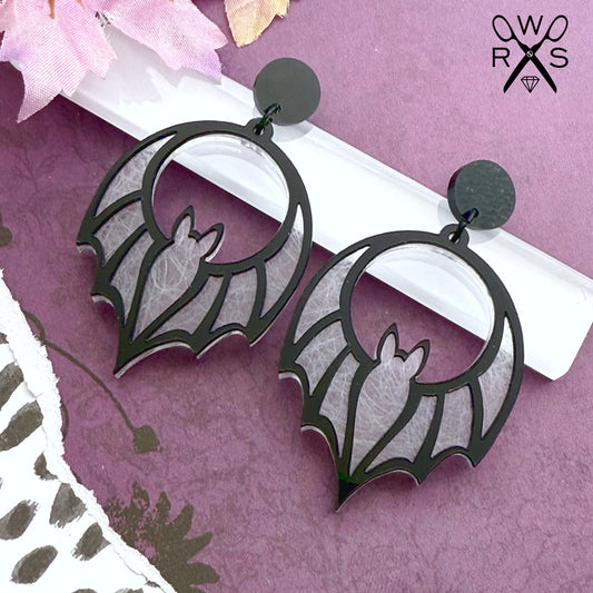 Batty Babe Dangles in White Web and Black