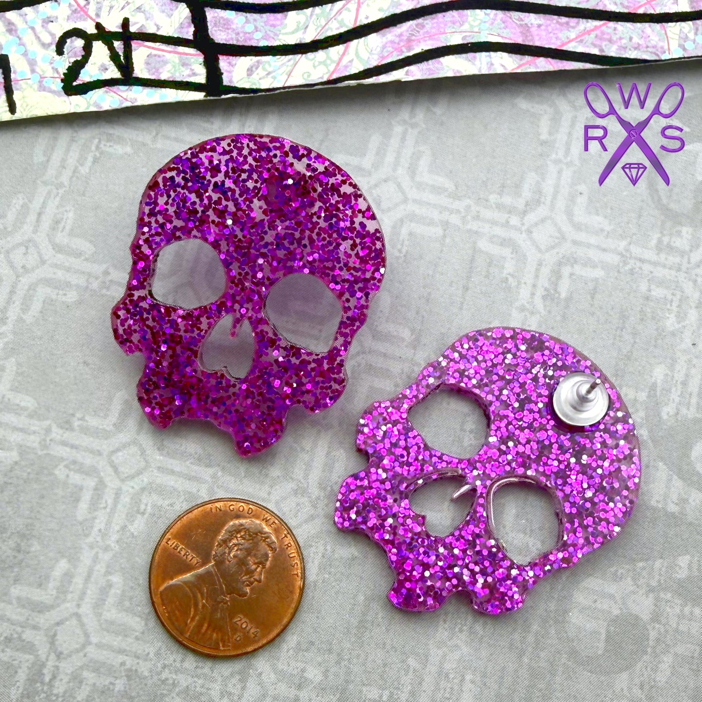 Skull Crush Statement Studs in Purple Glitter